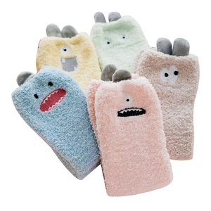 Soft coral fleece mid-calf socks with cute cartoon monster patterns in five colors