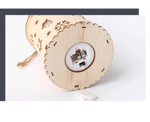 Macro view of wooden lantern base featuring LED battery compartment and star cutouts