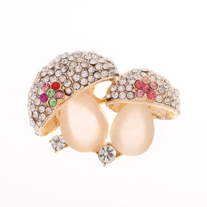 Elegant gold mushroom brooch with sparkling crystals and pearly opal cat eye stone finish