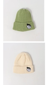 Detail of core-spun yarn knit beanies with ribbed texture and cartoon embroidery