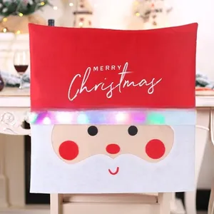 Detail of Christmas chair cover with Santa Claus design, LED lights, and Merry Christmas text