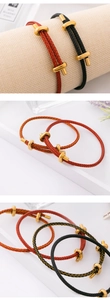 Detail of adjustable 3mm steel wire bracelets with golden T-buckle in multiple colors