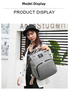 Outdoor shot of a grey multifunctional diaper backpack with large front storage pocket