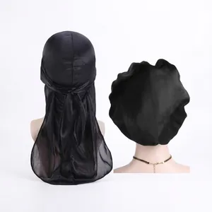 Detail view of premium black silky durag and matching sleep cap with long tail ribbons