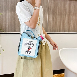 Blue sequin oil drum handbag with BAD BITCH FUEL lettering and golden chain strap