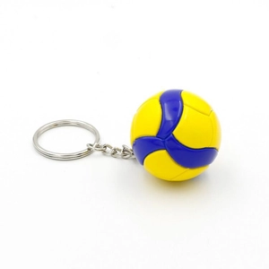 Detail of yellow and blue volleyball keychain featuring leather-like stitched texture