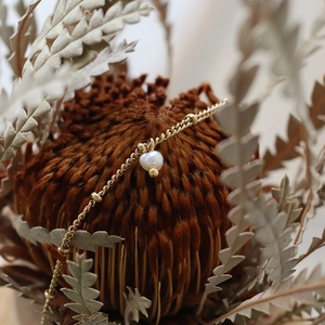 Miniature freshwater pearl and gold bead bracelet crafted in 18K gold-plated titanium steel