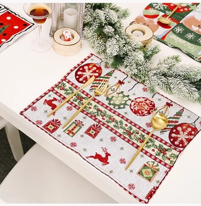 Close-up of festive Christmas placemat with knitted reindeer and snowflake patterns