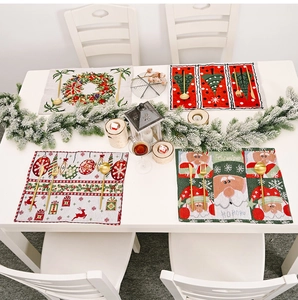 Detail of four Christmas knitted placemats with festive patterns for holiday table decor