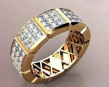 Detailed macro view showing the intricate honeycomb interior of a wide gold-plated ring