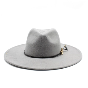Detail of grey wool fedora hat with black leather strap and gold buckle accent