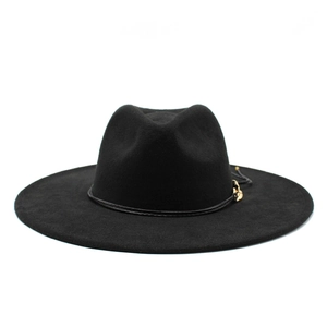 Detail of wool felt fedora hat featuring a black band and gold metallic buckle