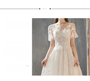 Detail view of round neckline with transparent mesh and delicate lace flower embroidery