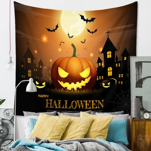 Detail of Halloween tapestry featuring pumpkin, castle and bats hanging over a bed