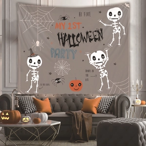 Detail of Halloween tapestry with cartoon skeletons and pumpkins over a sofa