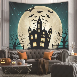 Halloween tapestry with castle and full moon displayed above a sofa in a cozy living room