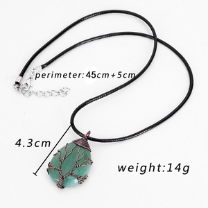 Detail of tree of life wire-wrapped green stone pendant with 45cm cord length and 14g weight
