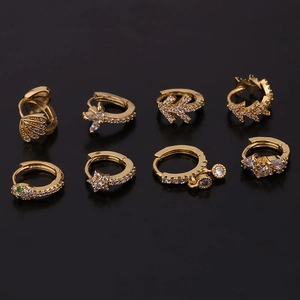 Detailed set of eight gold snake and leaf earrings with green and clear zircons