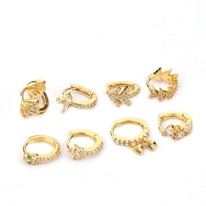 Set of eight gold-plated snake and geometric stud earrings with sparkling cubic zirconia