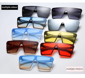 Close-up of vintage rimless square sunglasses available in a variety of vibrant lens colors
