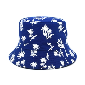 Close-up of tropical palm tree and flamingo print on navy cotton bucket sun hat