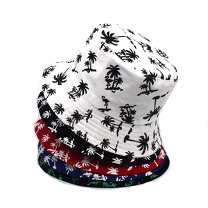 Reversible bucket hat with tropical palm tree print for summer outdoor sun protection