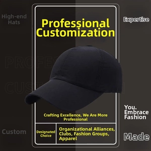 Detail view of the black cotton baseball cap with ventilation eyelets and curved brim