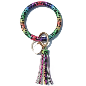 Detail of colorful leopard print PU leather wristlet keychain with tassel and white blank tag