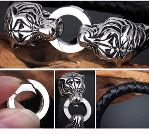 Close-up of tiger head metal clasp and black braided leather strap texture on bracelet