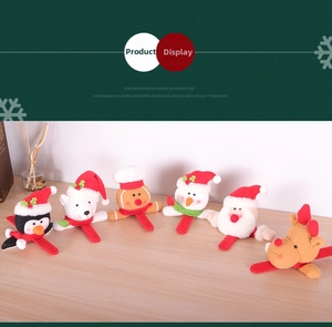 Detailed view of six assorted plush Christmas slap bracelets including Santa and Snowman