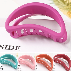 Detailed close-up of colorful hollow star hair claws with a premium matte finish