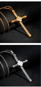 Detail of hip hop cross pendants in gold and silver with twisted rope design