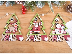 Detailed view of three painted wooden Christmas tree ornaments with reindeer and santa