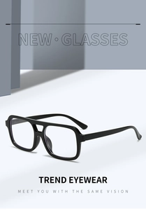 Detail of trendy square double-bridge sunglasses with matte finish on a minimalist stand