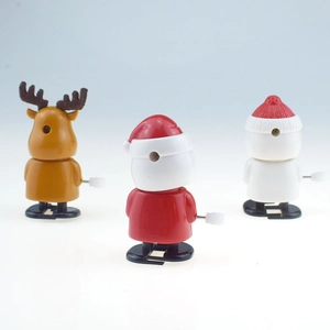 Back view of clockwork Christmas toys featuring Santa, reindeer, and snowman