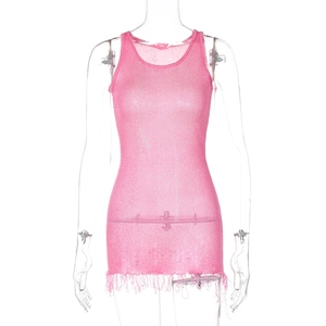 Close-up of pink knit mini dress featuring a round neck and dense fringe hem details