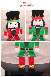 Detail of Nutcracker Christmas chair cover showing felt applique and linen fabric texture