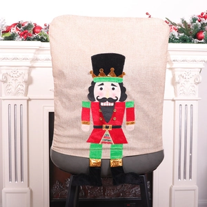 Christmas nutcracker chair cover in red and green burlap for festive dining room decor
