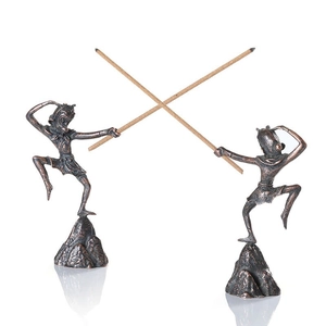 Detailed close-up of bronze Sun Wukong incense holders with intricate antique finish