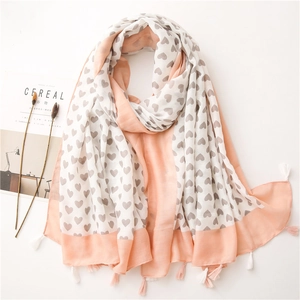 Peach pink and white cotton linen scarf with gray heart pattern and tassel edges