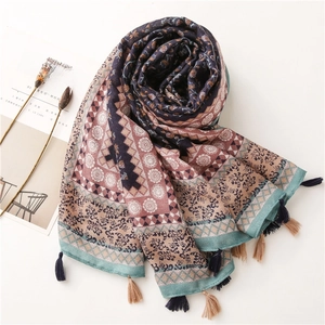 Detail of colorful bohemian floral print scarf with soft tassels and cotton-linen texture