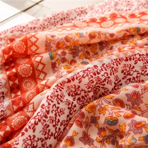 Detailed macro view of bohemian floral print on ethnic style cotton linen shawl scarf