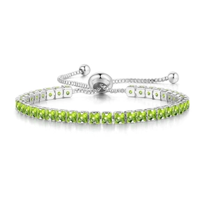 Detail of adjustable silver bracelet with square-cut green zircons and sliding clasp