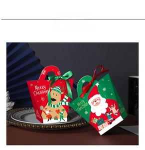 Detail of Christmas gift boxes with reindeer and Santa motifs and satin ribbon handles