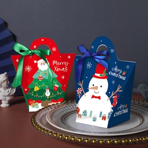Christmas gift boxes with Santa and Snowman patterns on a decorative glass tray