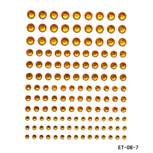 Detailed sheet of orange round faceted self-adhesive acrylic rhinestones in various sizes