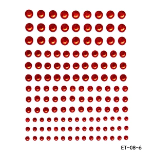 Detailed view of self-adhesive red round acrylic rhinestones in assorted sizes