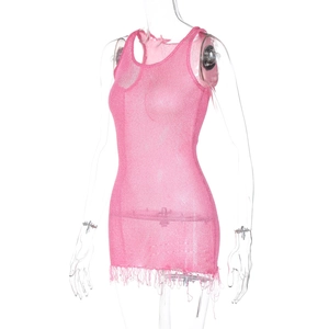 Detail of hot pink knit mesh dress showing the sleeveless cut and fringe hemline