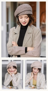 Detail view of stylish houndstooth plaid beret showing texture and vintage autumn design