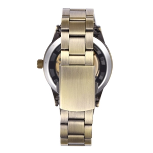 Macro view of bronze mechanical watch caseback showing the intricate skeleton movement